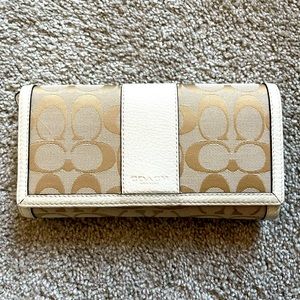 Coach trifold wallet with checkbook.